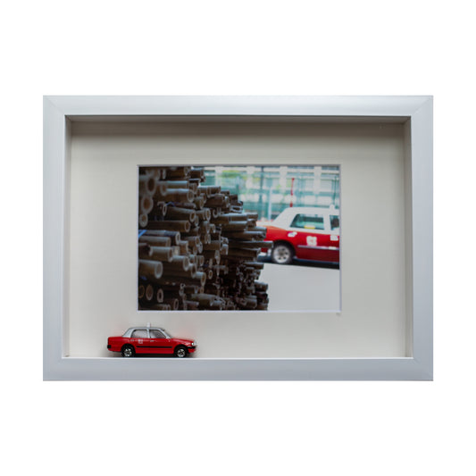 White frame of bamboo taxi with miniture taxi toy