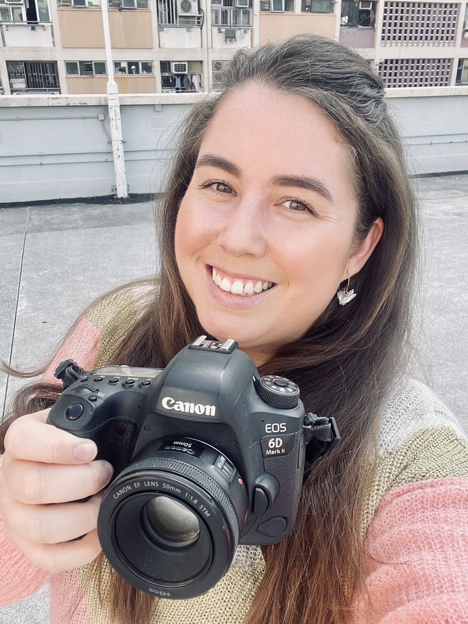 An image of owner Nicole and her camera in the streets of Hong Kong