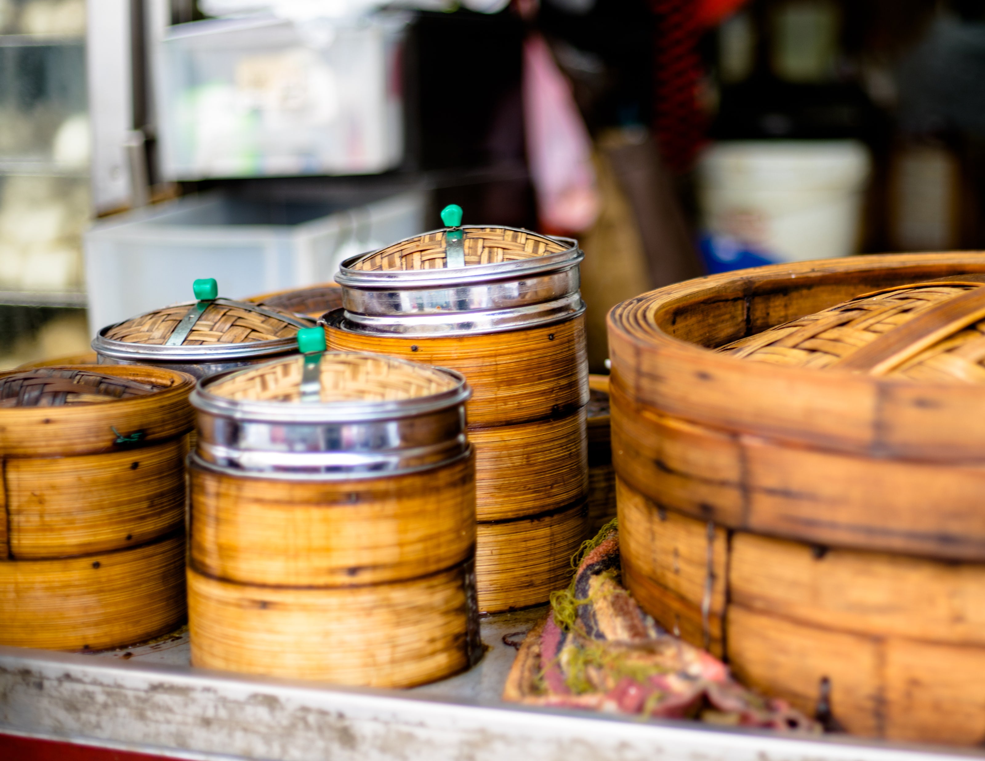 Wooden dimsum baskets stacked up on a street photography walk in hong kong
